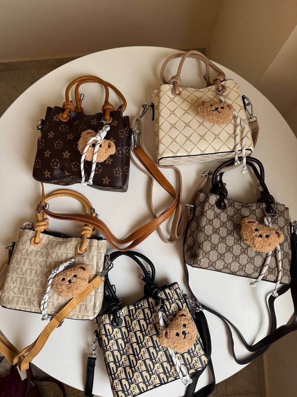 cross bag with bear charm