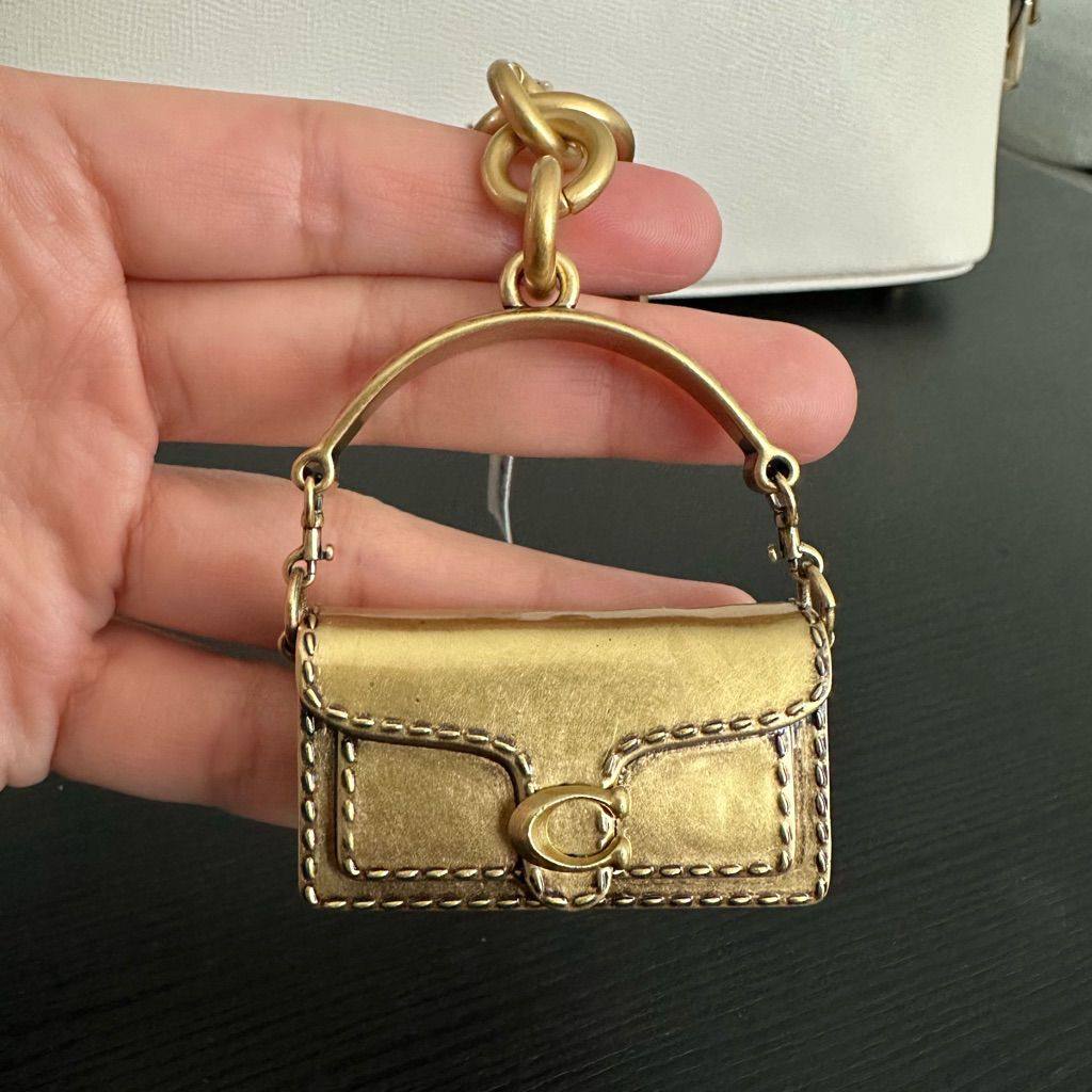 Coach gold tabby charm