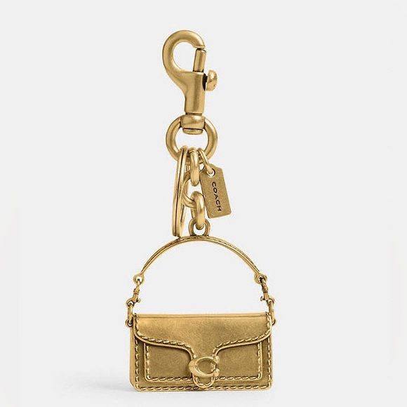Coach gold tabby charm