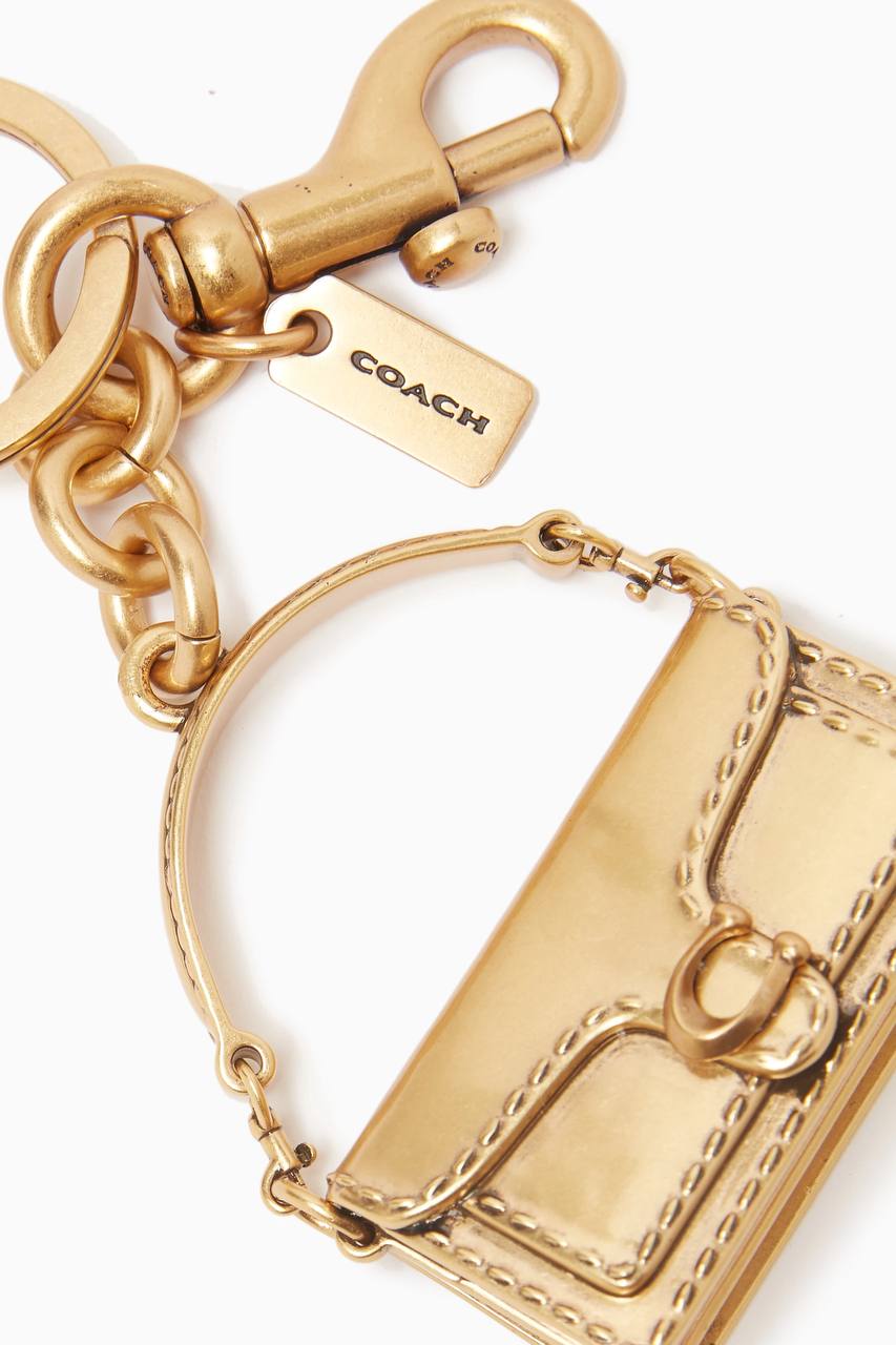 Coach gold tabby charm