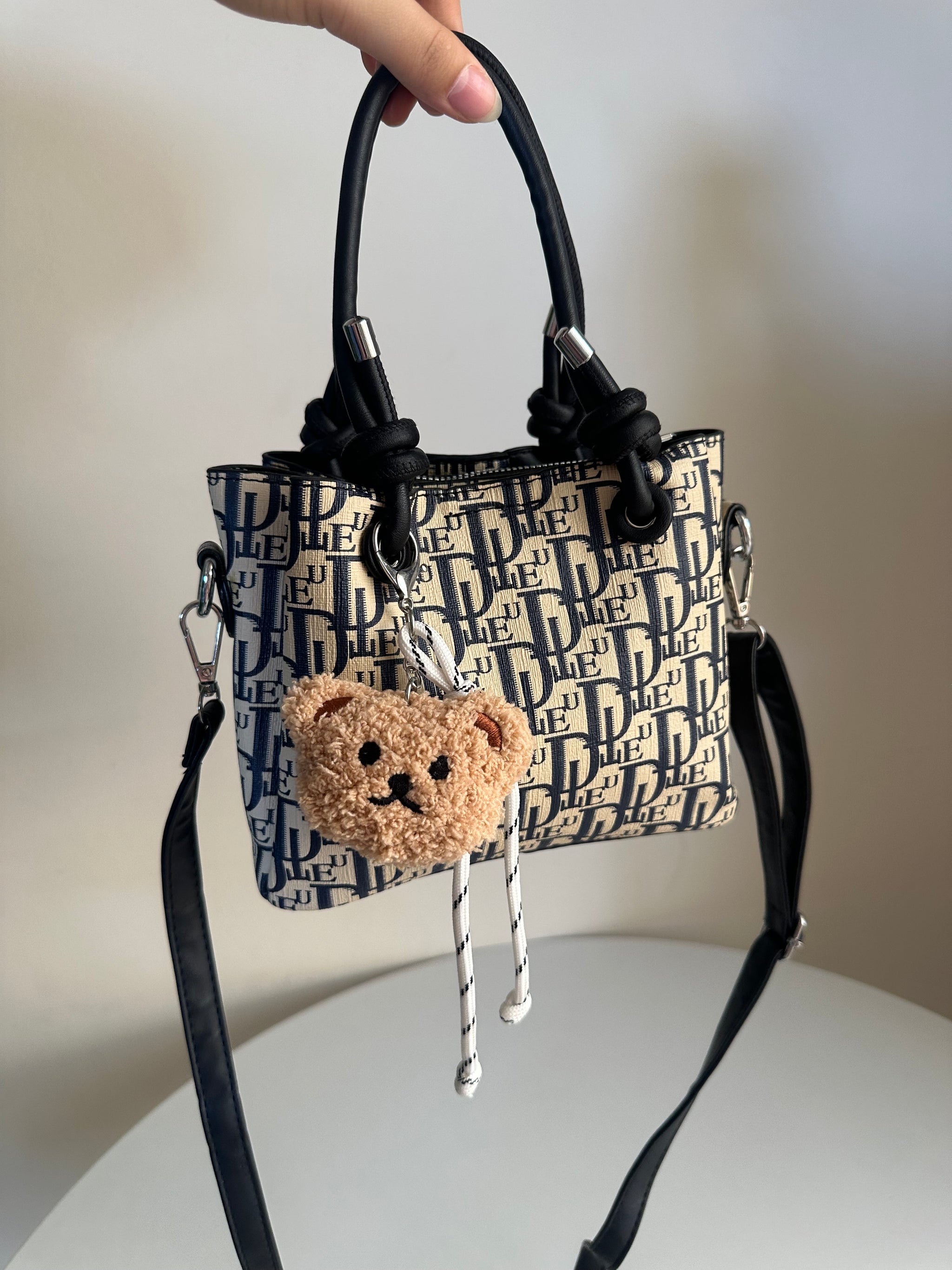 cross bag with bear charm