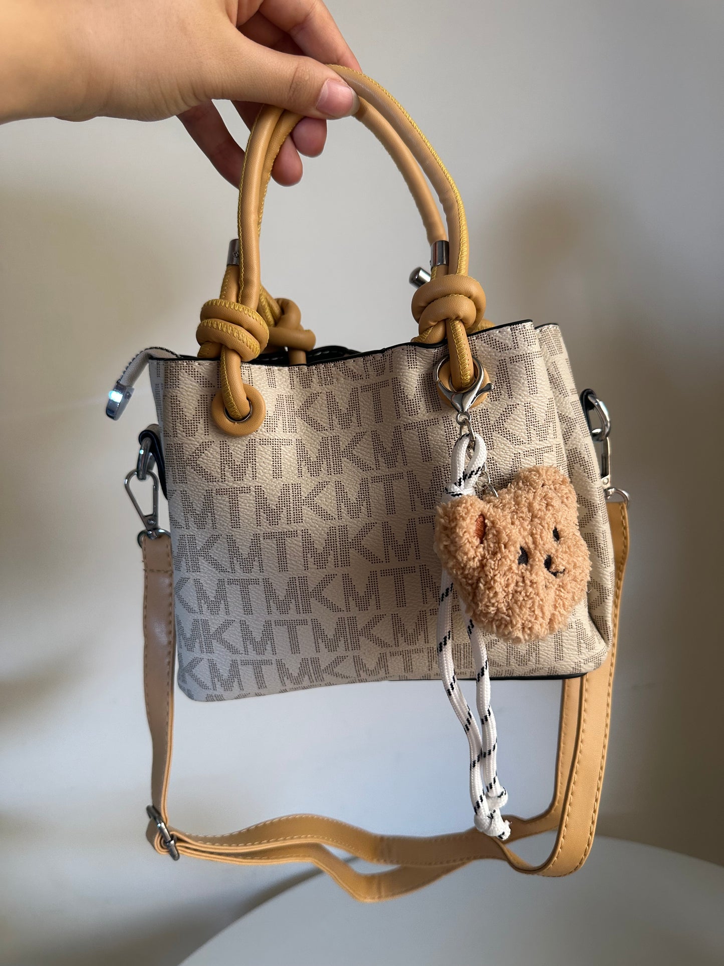 cross bag with bear charm