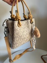 cross bag with bear charm