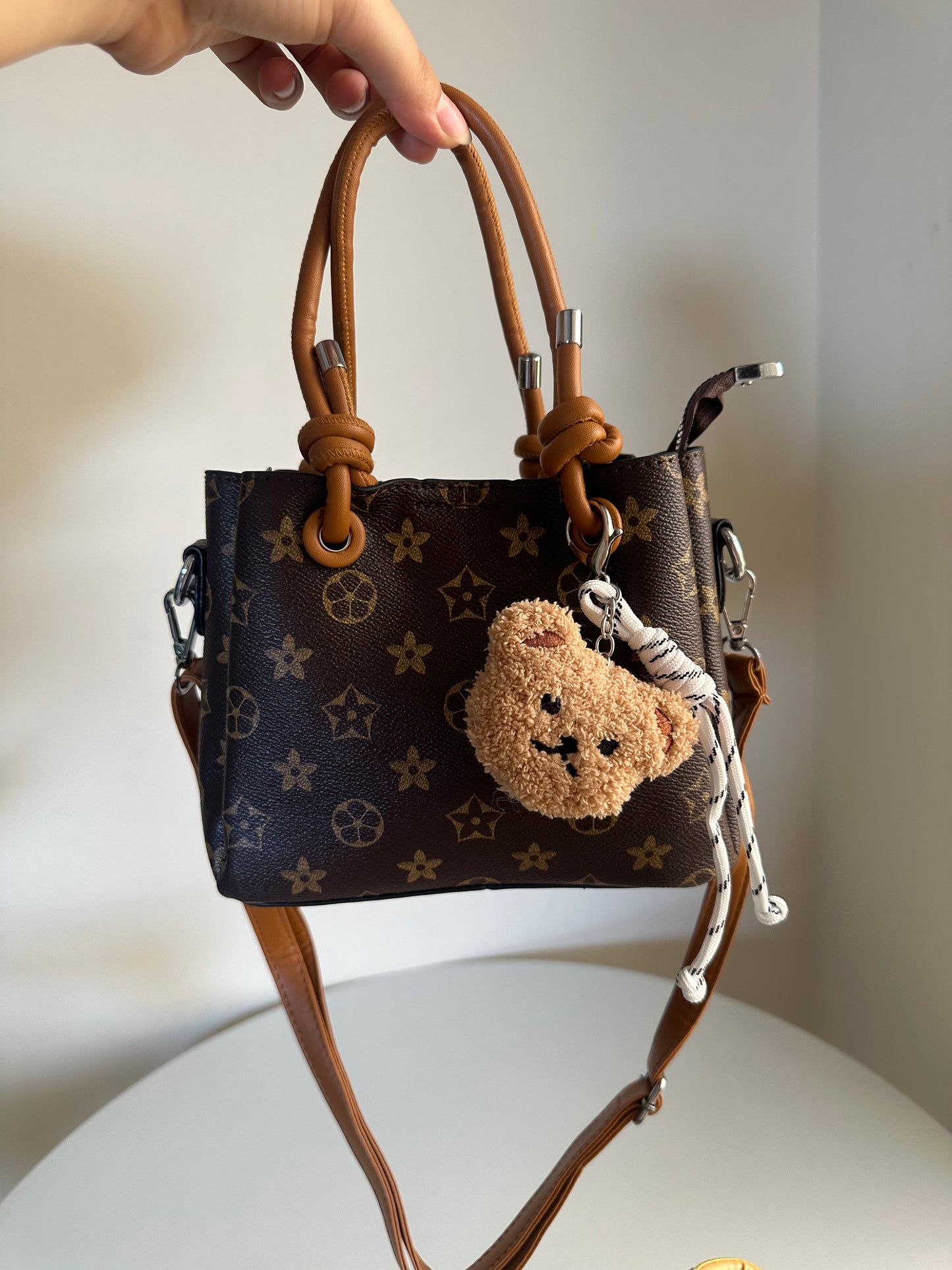 cross bag with bear charm