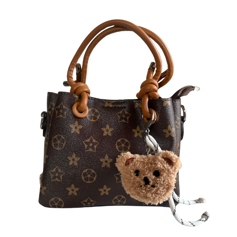 cross bag with bear charm