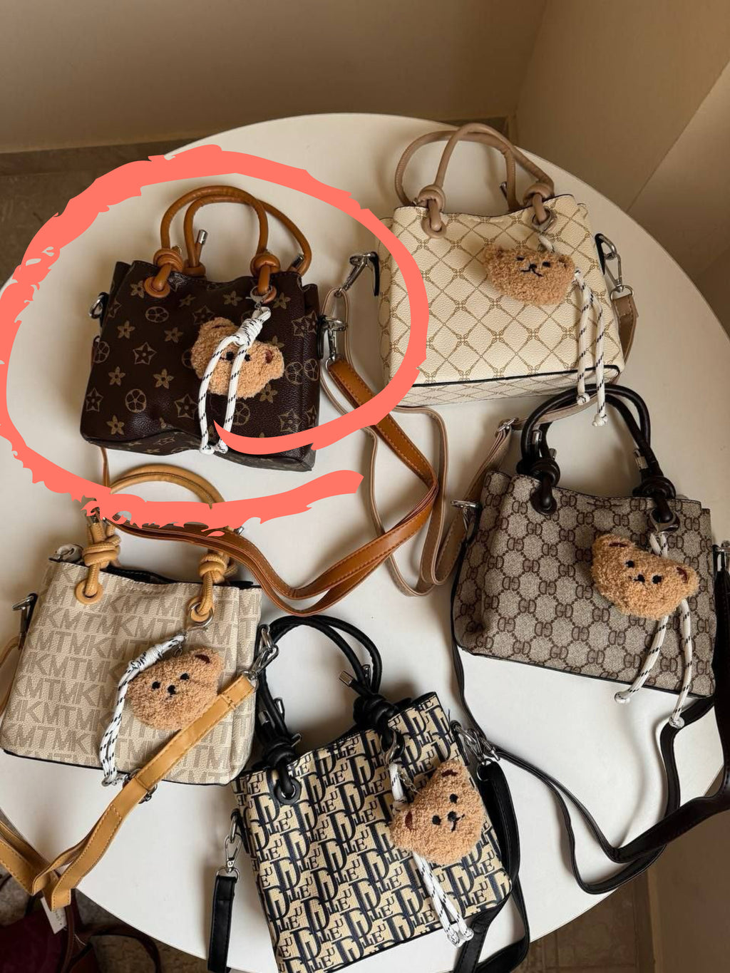 cross bag with bear charm